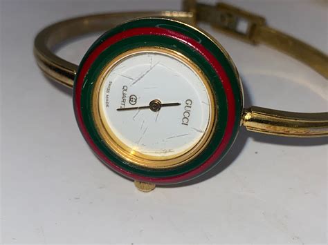 vintage gold gucci watch with multi interchangeable bezels